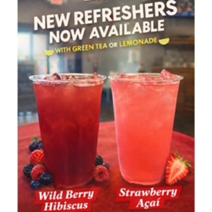 Two refreshers, Wild Berry Hibiscus and Strawberry Açaí, with fruit and text "New Refreshers Now Available".