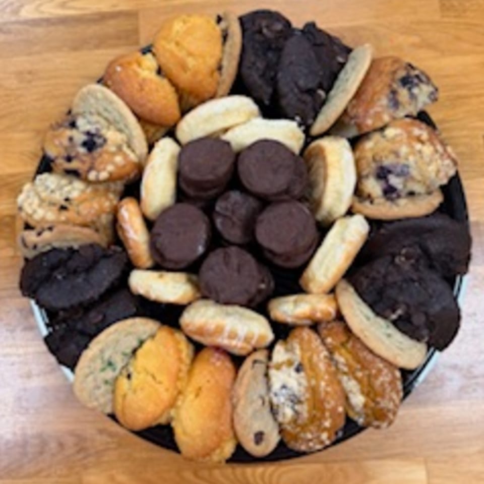 A platter of assorted muffins, cookies, and chocolate sandwich cookies from Redhouse Bagels.