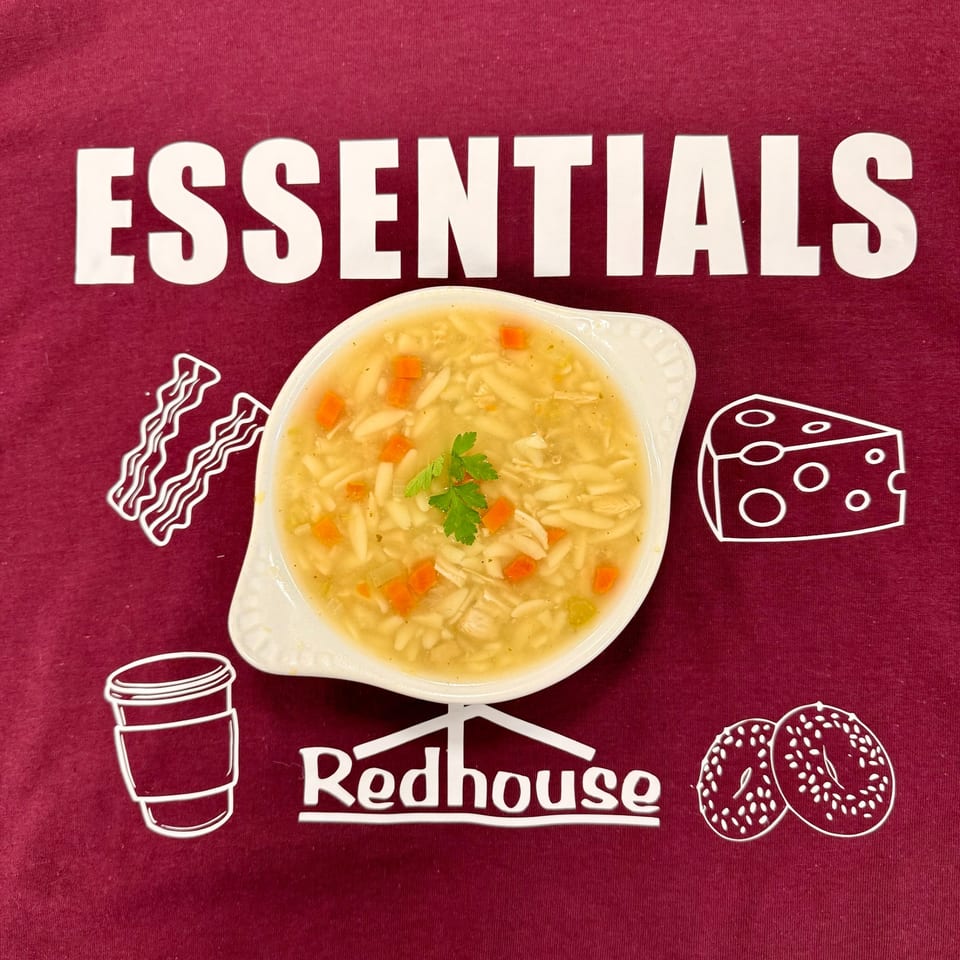Chicken noodle soup with carrots and parsley, surrounded by Redhouse Bagels branding and food icons.
